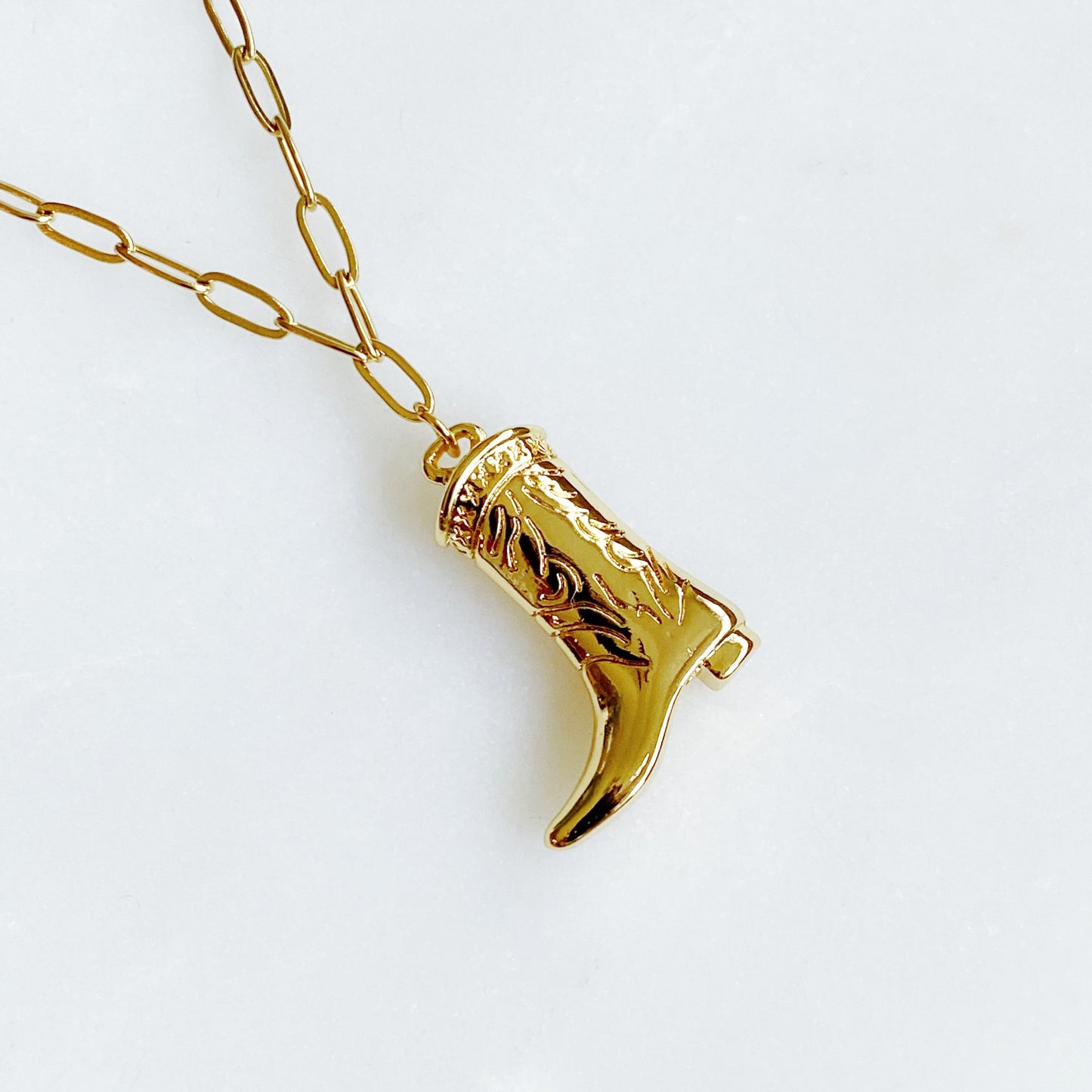 Gold cowgirl boot necklace with a detailed engraved pendant—your go-to piece for effortless Western style.