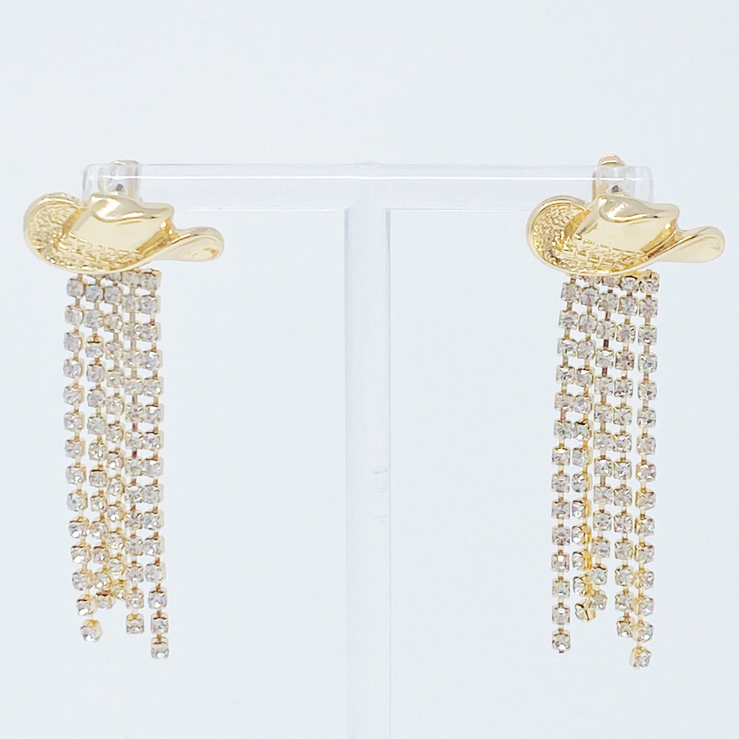 Sparkly cowboy hat fringe earrings that bring bold Western glam to any look.