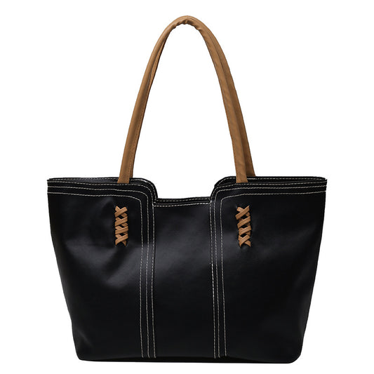 A refined everyday tote designed to carry your essentials with effortless sophistication.