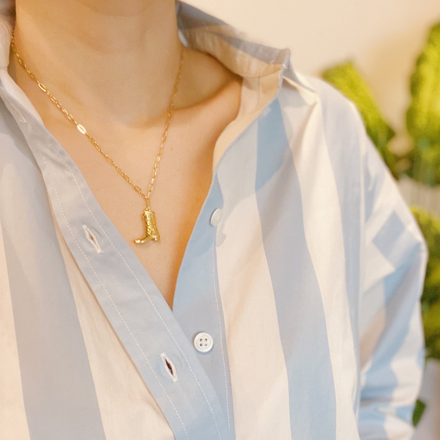 Gold cowgirl boot necklace with a detailed engraved pendant—your go-to piece for effortless Western style.