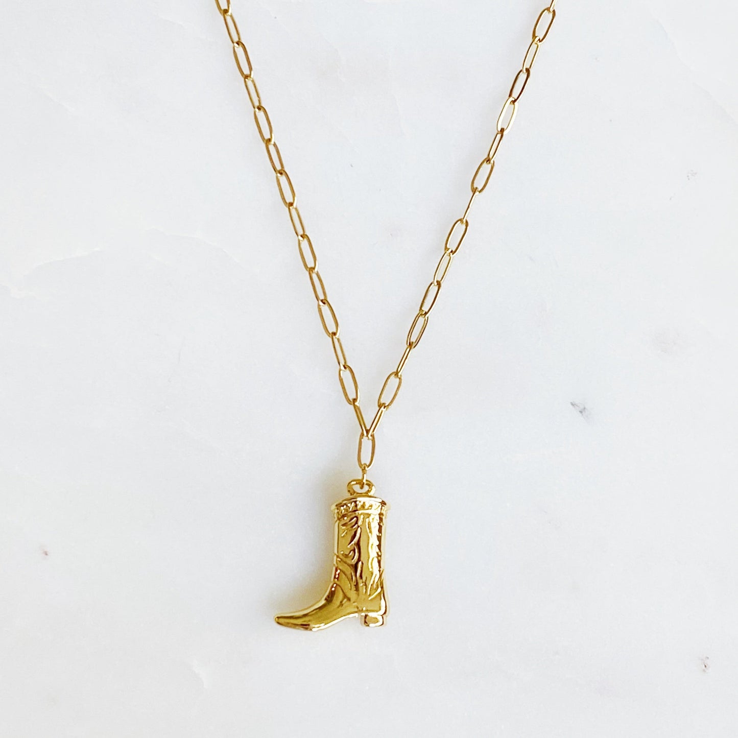 Gold cowgirl boot necklace with a detailed engraved pendant—your go-to piece for effortless Western style.