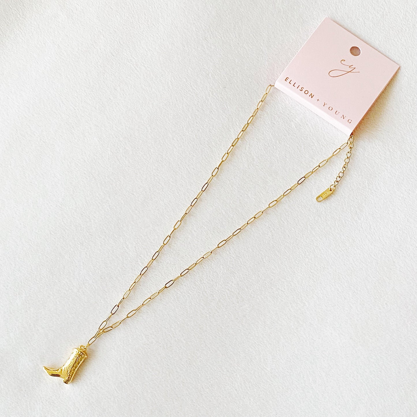 Gold cowgirl boot necklace with a detailed engraved pendant—your go-to piece for effortless Western style.